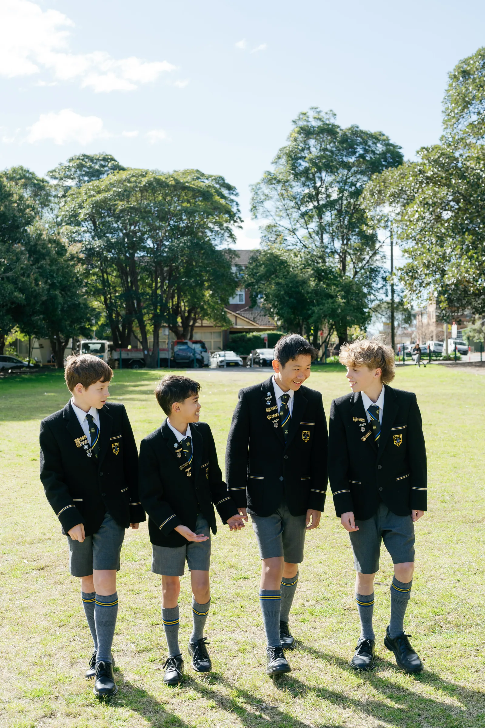 Coogee Prep boys walking together across the school field