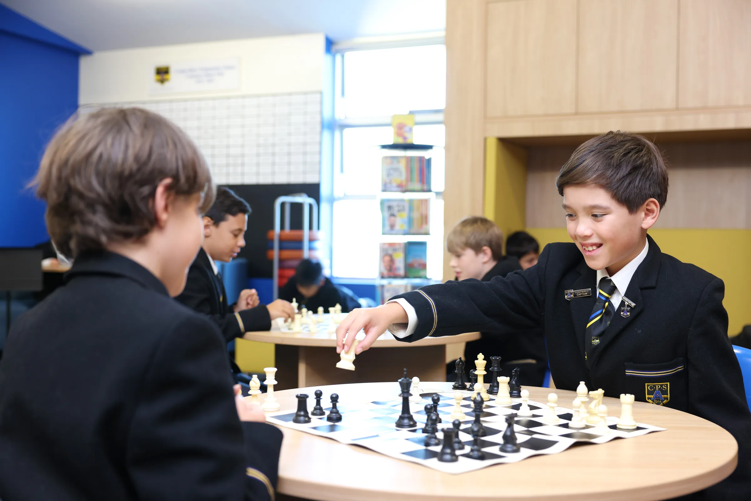 Coogee Prep boys playing chess in the library