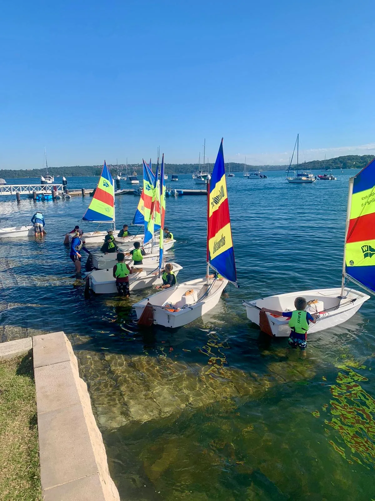 Coogee Prep boys sailing small boats on the water